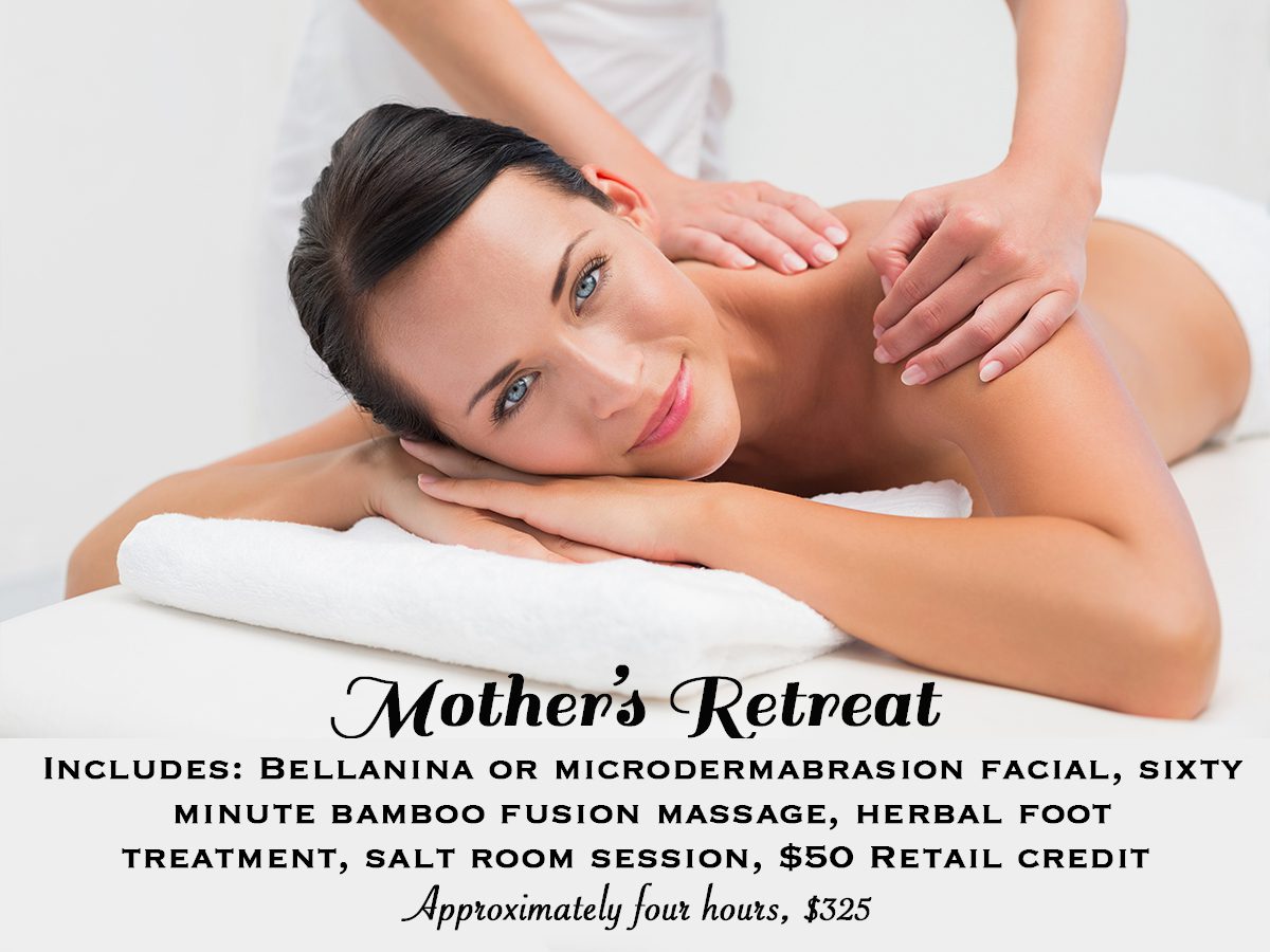 A woman getting her back massage at the spa.