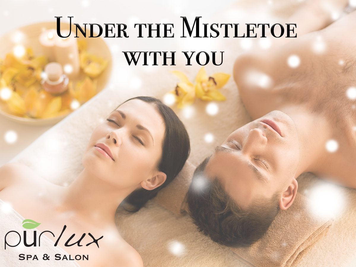 A man and woman laying on their backs in the spa.